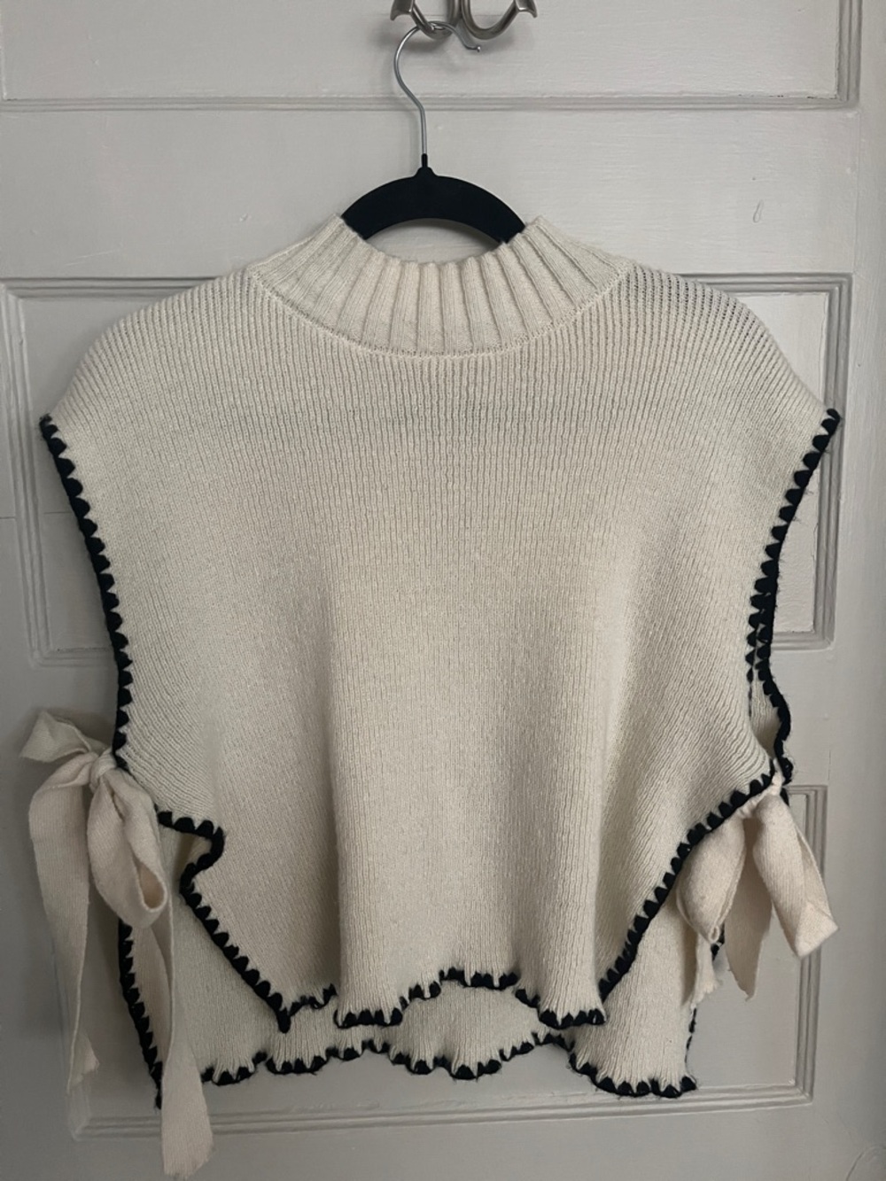Cream Knit Sleeveless Sweater with Black Trim